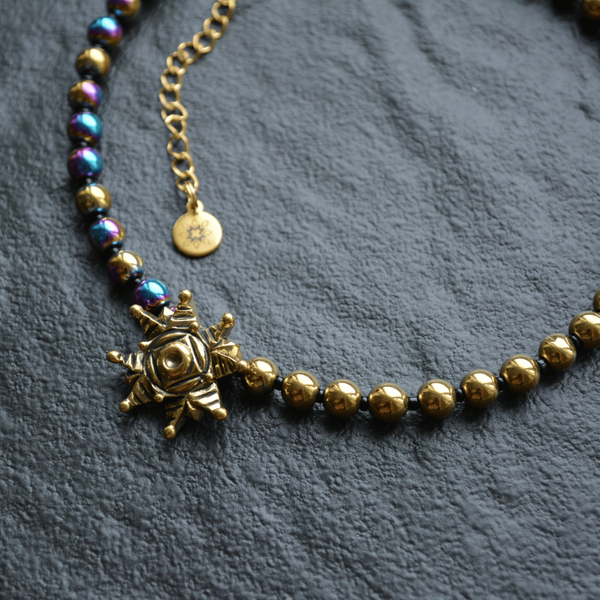 Necklace of halves of gold and rainbow hematite with star, Gold