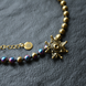 Necklace of halves of gold and rainbow hematite with star, Gold